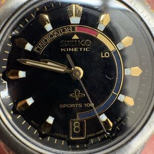 Seiko Kinetic Sports 100 Watch with Black dial and two tone band.  Women’s.